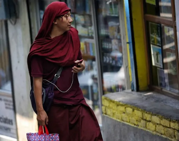 Men with red walking past